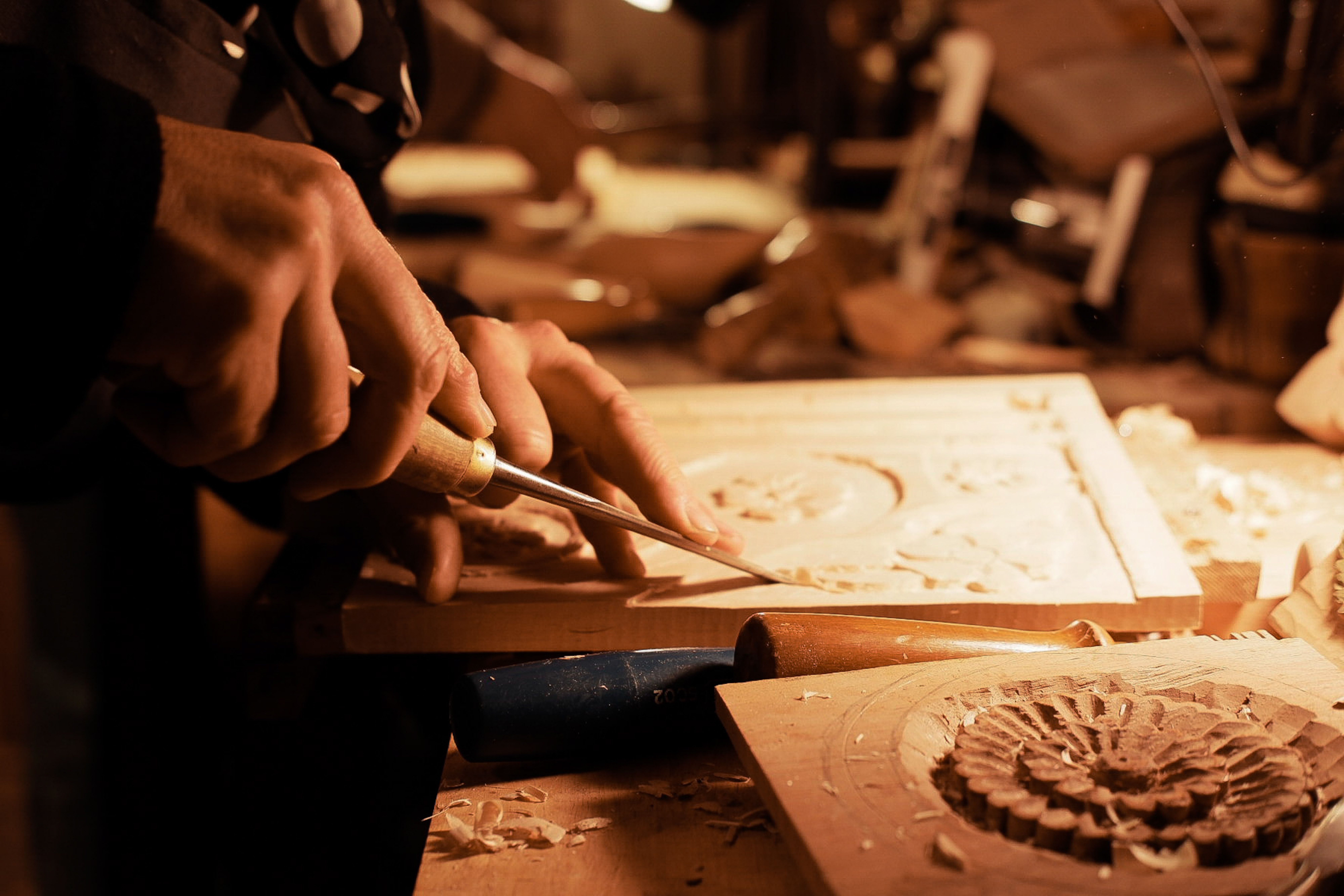 Artisan hammering brass